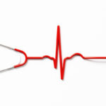 Heart pulse shaped stethoscope on white background. Health concept. Horizontal composition with copy space. Directly above.